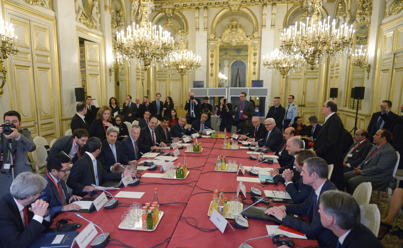 A general view shows US Secretary of State John Kerry (4th L, seated), French Foreign Minister Laurent Fabius (4th R) and other leaders at the start of the ministerial meeting on Syria at the Quai d'Orsay, Ministry of Foreign Affairs, in Paris on December 14, 2015. / AFP / POOL / MANDEL NGAN (Photo credit should read MANDEL NGAN/AFP/Getty Images)